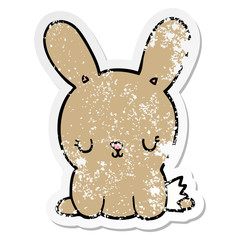 distressed sticker of a cute cartoon rabbit