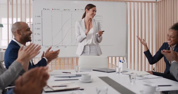 happy business people celebrating success in boardroom meeting enjoying corporate victory colleagues high five in office presentation
