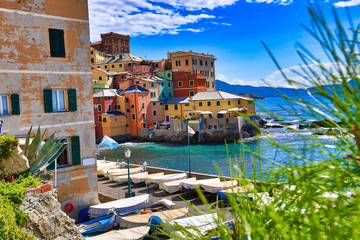 Boccadasse, Italy is a small fishing village in the Genoa (Genova) area.  This popular tourist attraction is easy to get to from the city.  the colorful village sits on the shores of the Mediterranean - obrazy, fototapety, plakaty