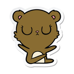 sticker of a peaceful cartoon bear