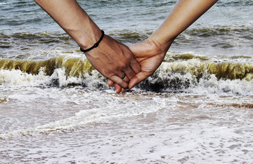 hands on the beach