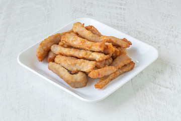 Dried pork fried  on white background.