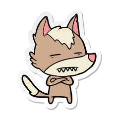 sticker of a cartoon wolf showing teeth