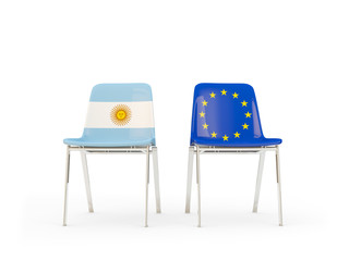 Two chairs with flags of Argentina and european union