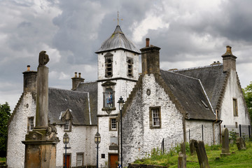 Fototapeta na wymiar 17th Century Burgh architecture of Cowanes Hospital with statue of John Cowane at Holy Rude Old Town cemetery on Castle Hill of Stirling Scotland