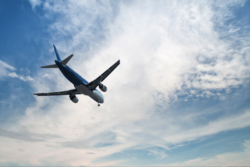 Fototapeta na wymiar Airplane over the clouds,
