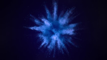 Super slowmotion shot of blue powder explosion isolated on black background.