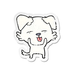 distressed sticker of a cartoon dog sticking out tongue