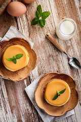 homemade caramel custard pudding with mint