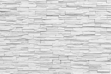 Surface white wall of stone wall gray tones for use as background.