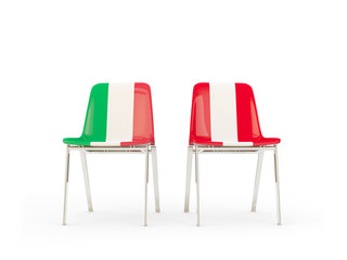 Two chairs with flags of Italy and peru