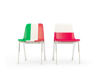 Two chairs with flags of Italy and poland