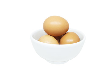 Close up many fresh egg stack in white small bowl isolated on white background.