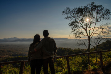 silhouette of a couple on sunrise background in the morning. copy space for text. happiness concept. as valentine's day concept