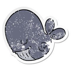 distressed sticker of a cartoon whale