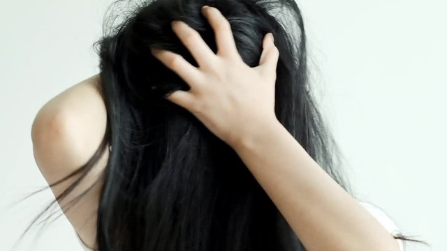 Slow motion of young beautiful asian woman spinning her head, angry mood. Social pressure issue concept.