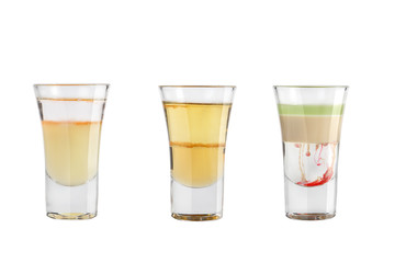 Set of alcohol shots on a white background. Three shots of alcoholic popular.