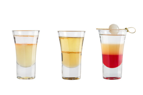 Set of alcohol shots on a white background. Three shots famous with strong alcohol.