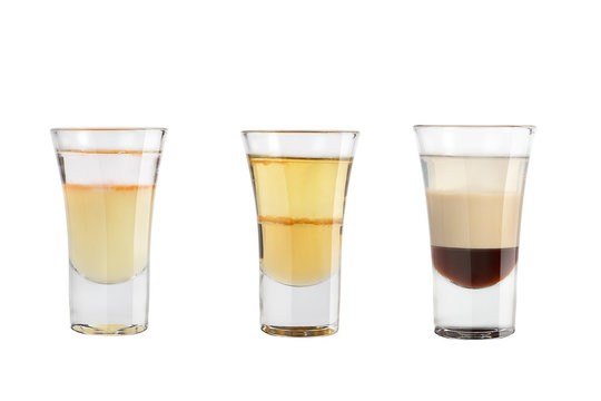 Set of alcohol shots on a white background. Three shots interesting with strong alcohol.
