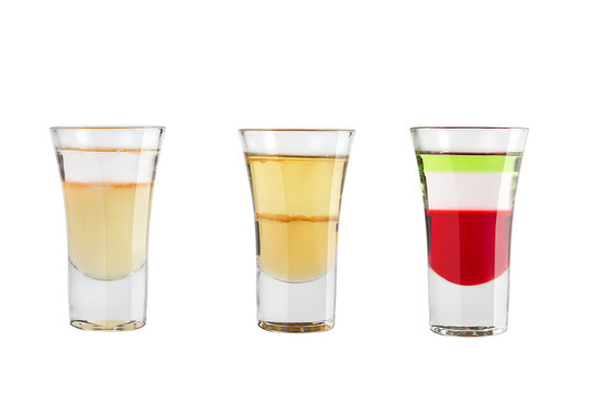Set of alcohol shots on a white background. Three shots of interesting different.