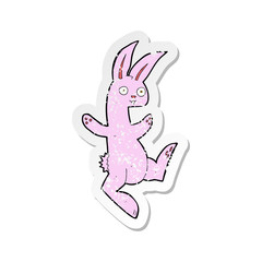 retro distressed sticker of a funny cartoon pink rabbit