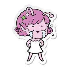 sticker of a cartoon crying alien girl