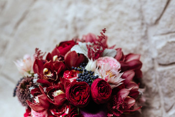 Pink rose flowers bouquet on light stone background