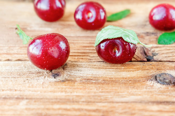 Cherry on wooden background