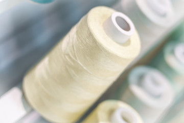 Background with a lot of yellow pastel  threads. stacked in a rows, Selective focus.blue tone palette. background.