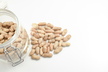 Roasted peanuts on white table