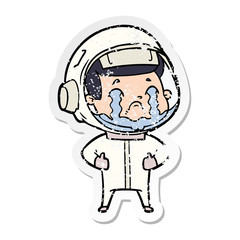 distressed sticker of a cartoon crying astronaut