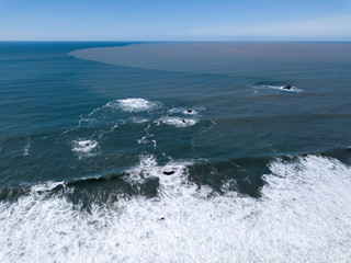 Russian River Drainage - Brown Russian River flood waters drain into the Pacific Ocean. Sonoma Coast, California, USA. 28Feb2019