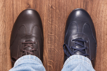 Elegant stylish navy blue and brown shoes for men on board