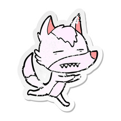 distressed sticker of a cartoon wolf showing teeth