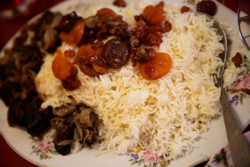 Caucasian traditional pilaf. Rice with meat and fruit