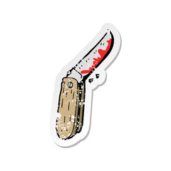 retro distressed sticker of a cartoon bloody folding knife