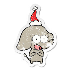 cute distressed sticker cartoon of a elephant wearing santa hat