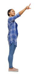 Side view of a black African-American woman in a shirt pointing upwards.