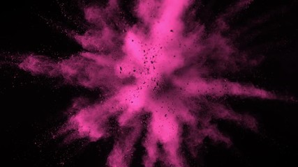 Super slowmotion shot of pink powder explosion isolated on black background.