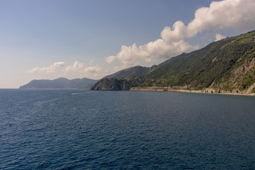 Italy, Cinque Terre, Manarola, a large body of water with a mountain in the background