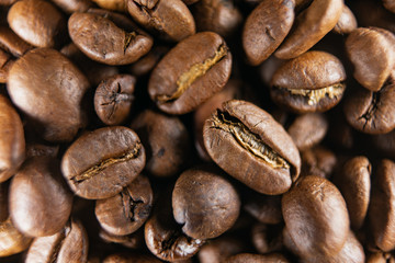 Roasted coffee beans, can be used as a background. Coffee beans texture macro.