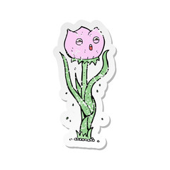 retro distressed sticker of a cartoon flower