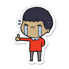 sticker of a cartoon man crying
