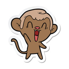sticker of a cartoon laughing monkey