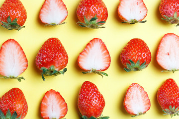 Pattern of strawberries isolated on yellow background, creative background