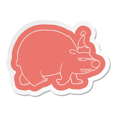 cartoon  sticker of a angry polar bear wearing santa hat