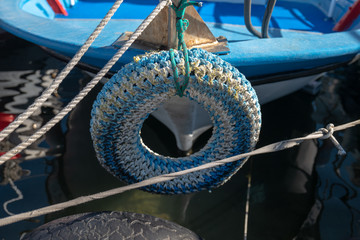 Car tire protecting fishing boat