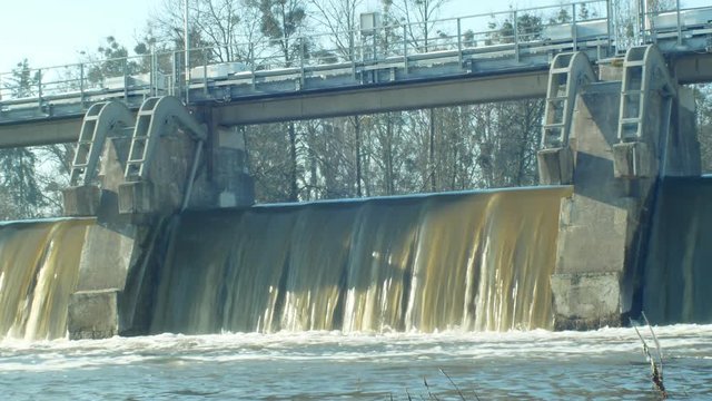 Weir On Morava River, Hydro-electric Power Station, in winter frozen water flowing down with ice and icicles, sluice floodgate and sluice-gate, Central Moravia, Czech Republic, Europe