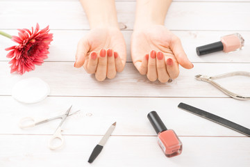 Obraz na płótnie Canvas Nail care and manicure. Beautiful female hands with nude nail polish