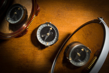 Compass which is reflected in the mirror